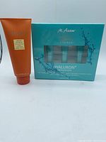 Front view of Borghese hand creme tube and M. Asam hyaluron infusion set