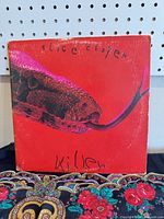 Front cover of Alice Cooper “Killer” LP showing snake artwork and visible edge wear