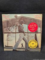Front of Glass Houses LP in shrink with hype sticker