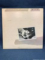 Front of outer album jacket showing title and dog photo artwork