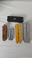 Group shot of all six multitools and knives