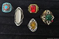 All five rings displayed on black tray