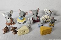 Group shot of all figurines and cheese wedges