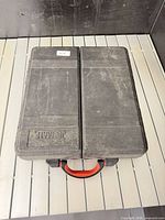 Closed JobMate hard plastic carry case with handle