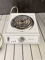 Front view of Superior electric hot plate showing power switch, knob and attached cord