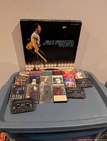 Full lot showing Bruce Springsteen box set, row of cassettes and two loose tapes