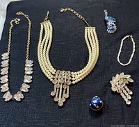 Overall lot view showing six jewellery pieces