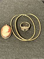 Cameo brooch-pendant, ring and hoop earrings grouped