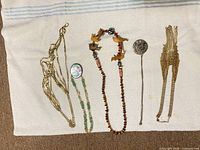 Overview of all six jewellery pieces laid out