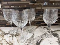 Group shot of four crystal wine glasses