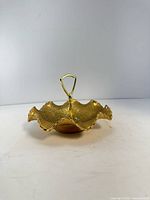 Double-shell handled candy dish showing gold finish and form