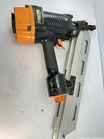Left side view of Freeman nailer showing body and magazine