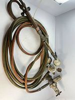 Full kit showing torch handle, regulators and coiled hoses