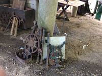 Wide view showing the entire assortment including the compass rose, urn planter, fence posts, and bird basket.