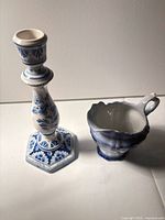 Candlestick and creamer side by side