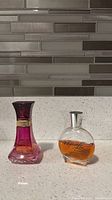 Both perfume bottles side by side on countertop