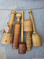 All five wooden mashers front view