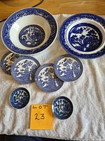 Overhead view showing all nine Blue Willow pieces
