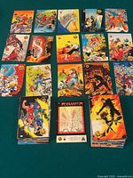 Overview of roughly 18 cards laid out plus two stacked piles and checklist card