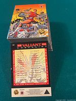 Stack of Valiant Era trading cards front view showing card 119 and hologram mention