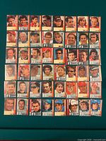 Overview of approximately 45 F1 trading cards laid out in grid