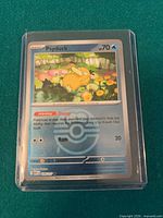 Front of Psyduck reverse holo card inside top loader