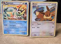 Front view of Vaporeon and Eevee cards standing upright