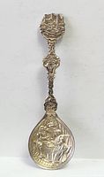 Full view of ornate souvenir spoon front