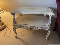 Full view of two-tier Rococo side table showing overall design and finish
