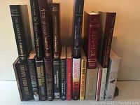 Photo showing 21 hardcover books including several Reader's Digest editions and other titles by various authors.