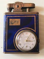 Front view of Eclydo lighter showing blue enamel finish with built-in round analog watch dial.