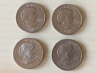 Obverse side showing profile of Susan B. Anthony, showing dates 1979 (two coins), 1980, and 1979-S with inscriptions 'LIBERTY' and 'IN GOD WE TRUST'.