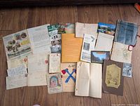 Full layout of all papers, envelopes, booklets on floor