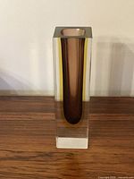 Square Murano glass vase showing clear casing and brown interior