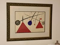 Full view of framed Calder print on wall