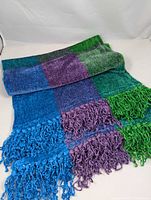 Scarf folded showing block colors and fringe
