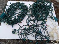 All three green-wire multicolour light strings and white extension cord displayed