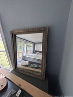 front view showing distressed wood frame and glass