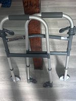 Front view of Drive Medical walker showing foldable frame and 2 front wheels
