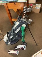 Full view of stand bag with clubs and headcovers