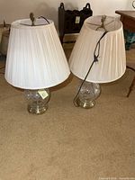 Both brass and crystal lamps with shades
