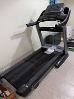 Side view of NordicTrack C1750 treadmill showing deck, rails, and console