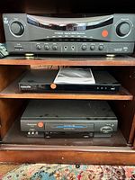 Full view of receiver, Blu-ray player and VCR in shelving