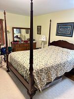 Full view of queen four-poster bed with mattress