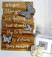 Front view of wall sign showing text and three corrugated metal butterflies; porcelain trinket box and packaging visible beside it