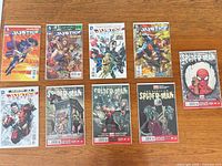 Group shot of all ten bagged & boarded comics laid flat