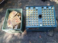 Top view of bingo machine alongside crate of bingo cards