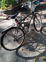 Full view of Peugeot hybrid bicycle with accessories attached
