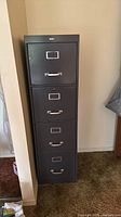 Front view of the dark gray four-drawer Cole filing cabinet