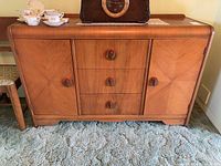 Front view of sideboard showing overall design and hardware